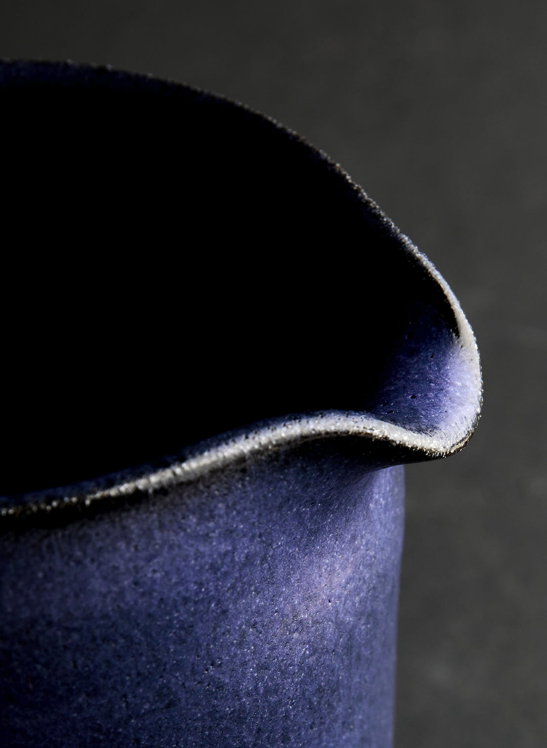 a close up of a blue pitcher