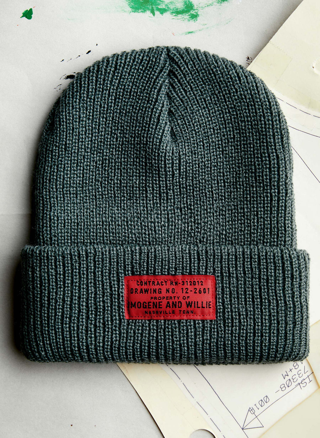 a knit hat with a red label