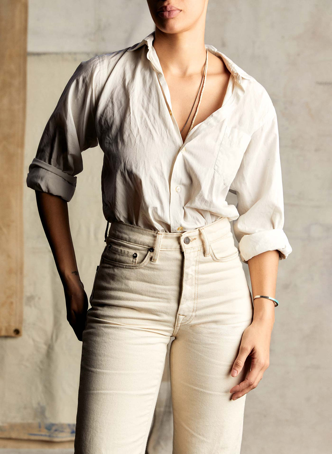 a woman in white shirt and white pants