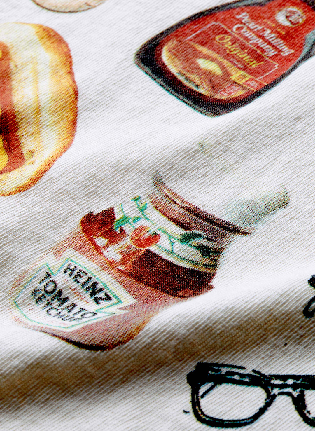 a close up of a fabric with a picture of a jar