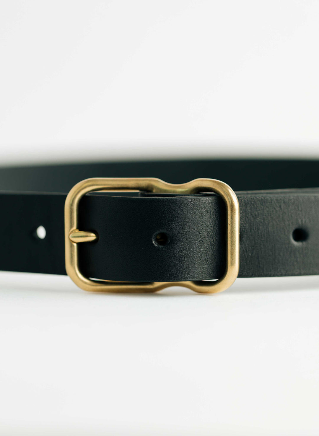 a black belt with a gold buckle