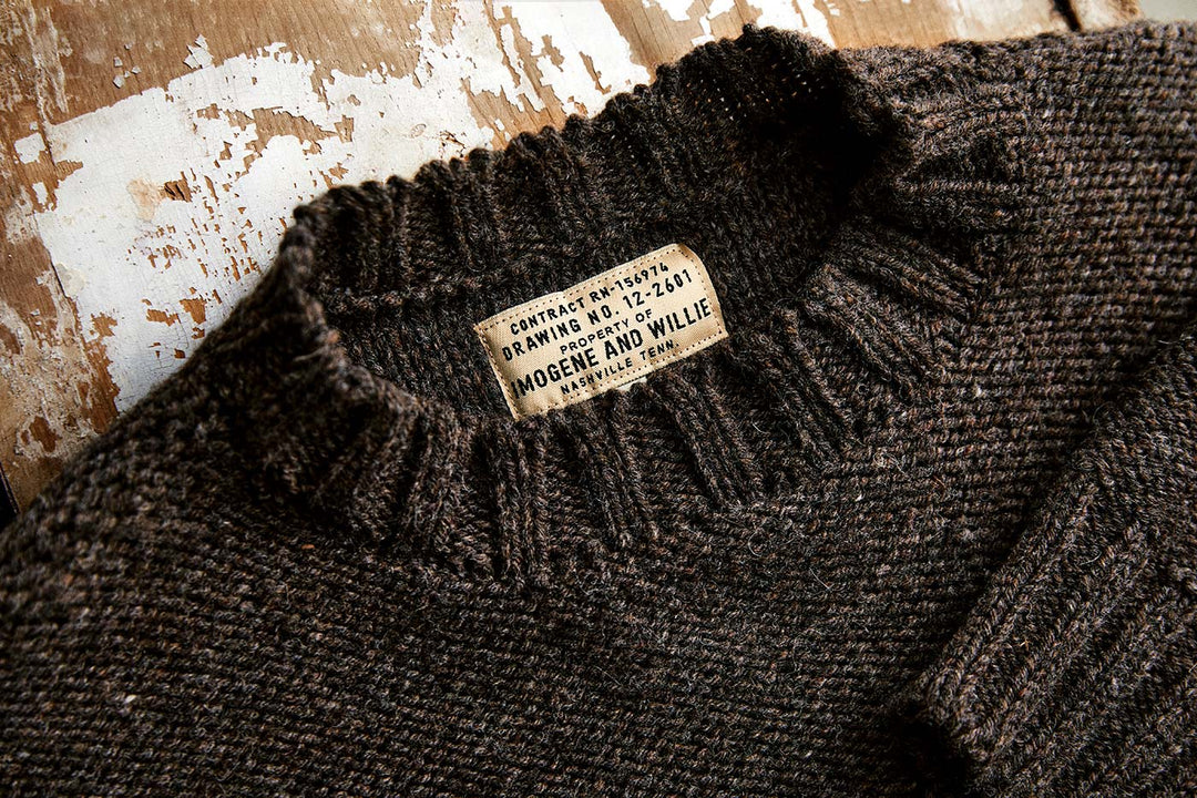 a brown sweater with a label on it