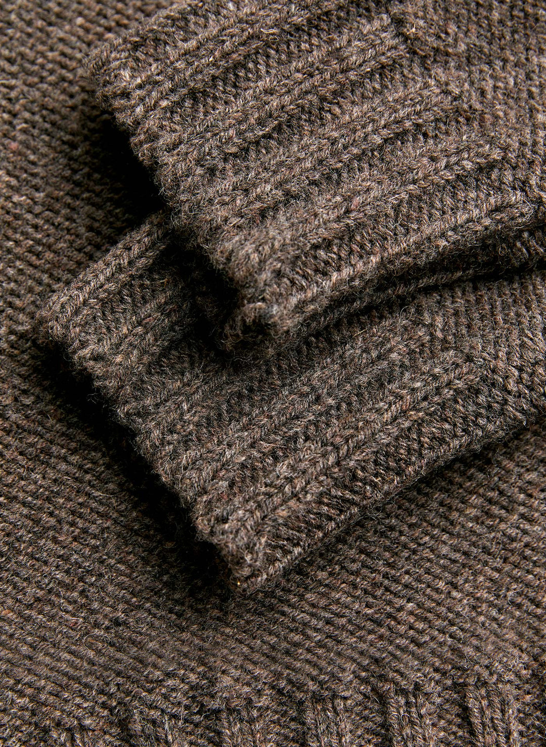 a close up of a brown knitted sweater