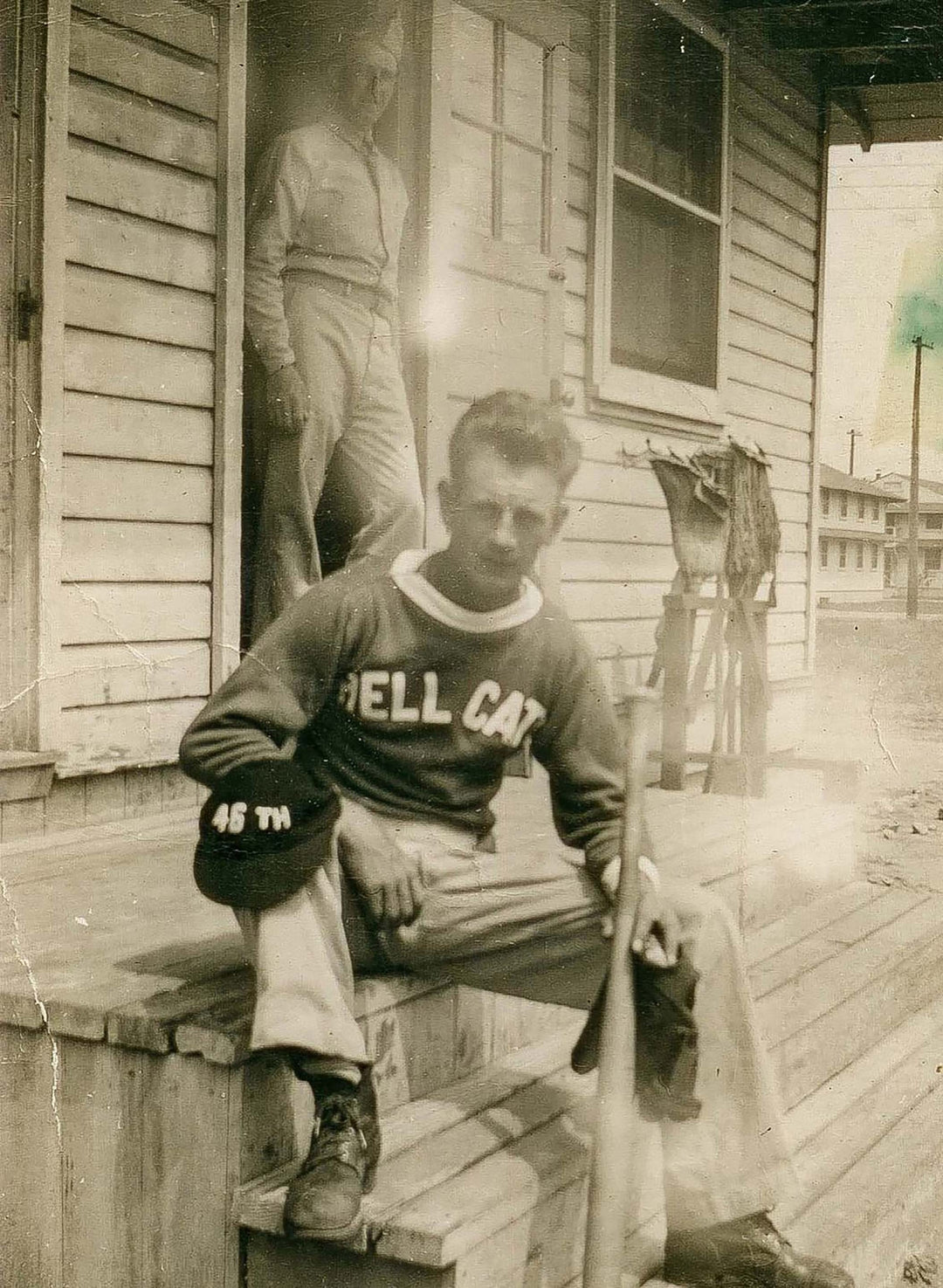 a man sitting on a porch