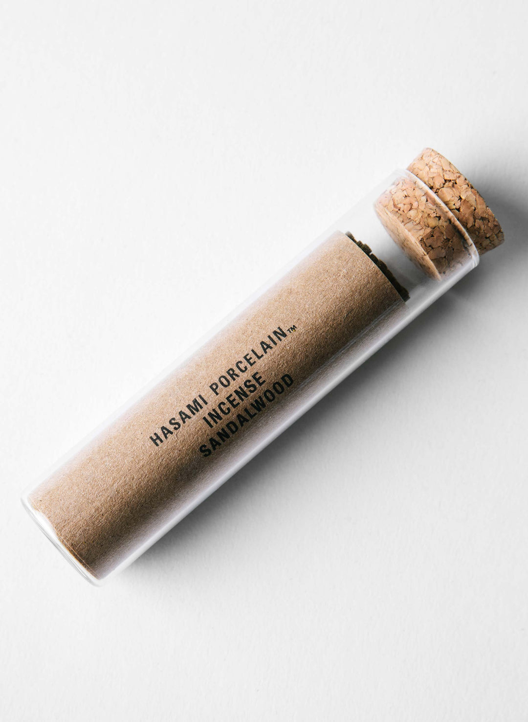 a glass tube with cork and cork on top