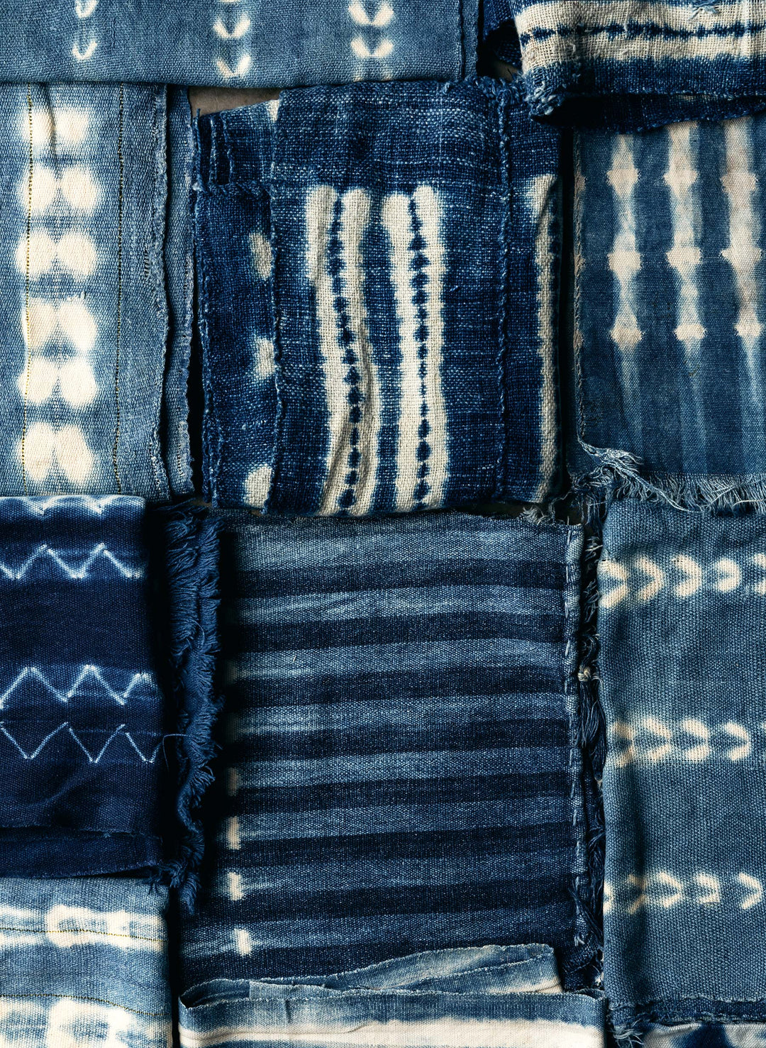 a patchwork of blue and white fabric