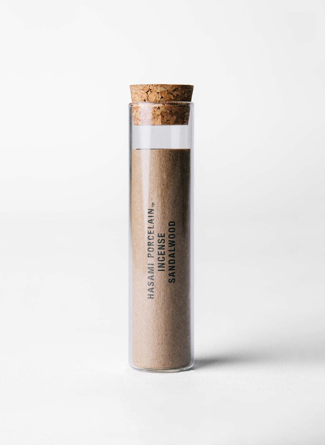 a glass tube with sand in it