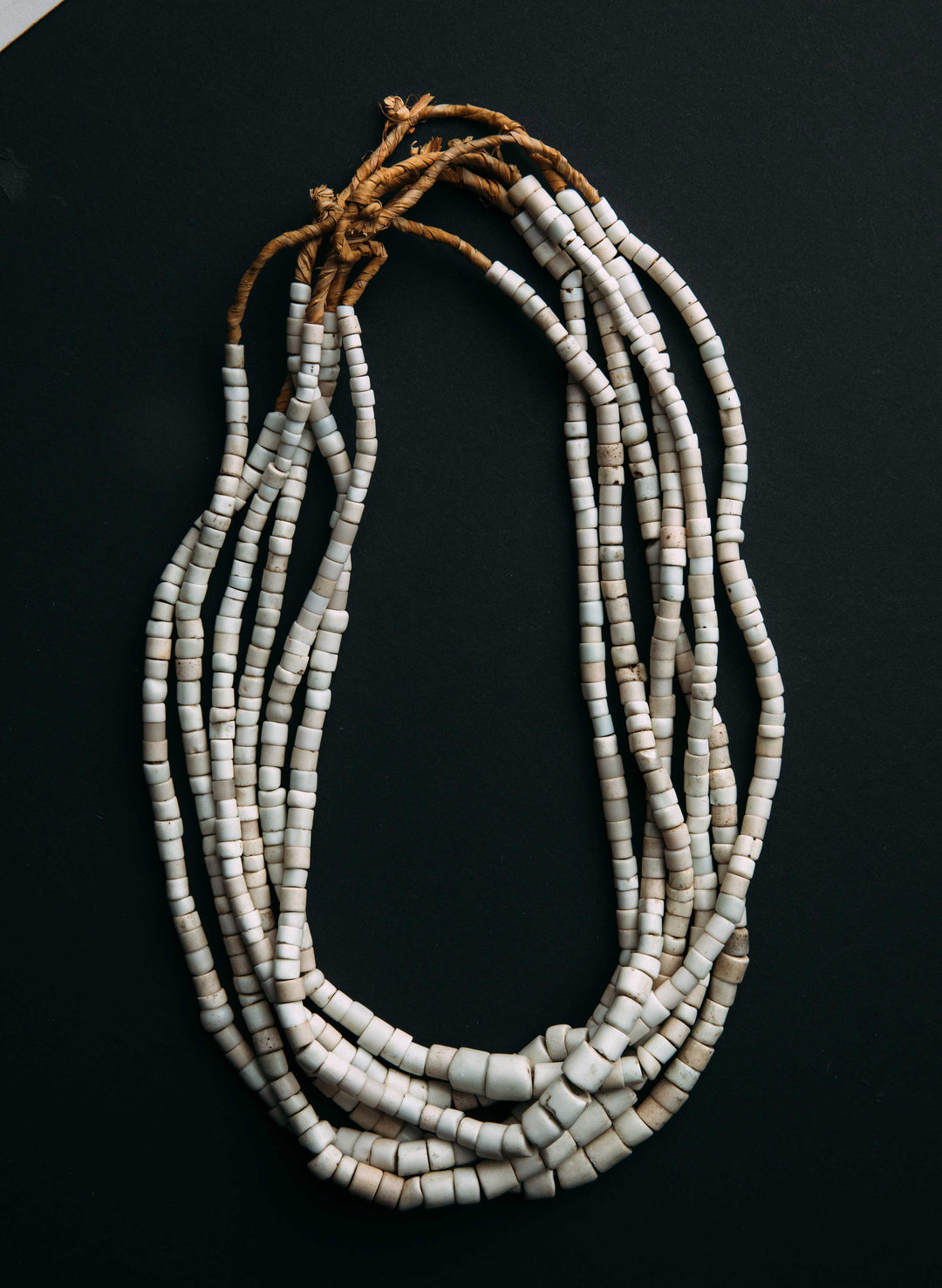 a necklace made of white beads