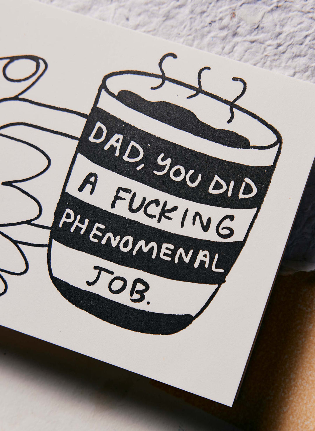 a card with a drawing of a cup