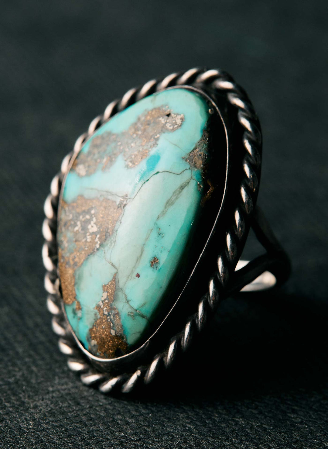 a ring with a blue stone