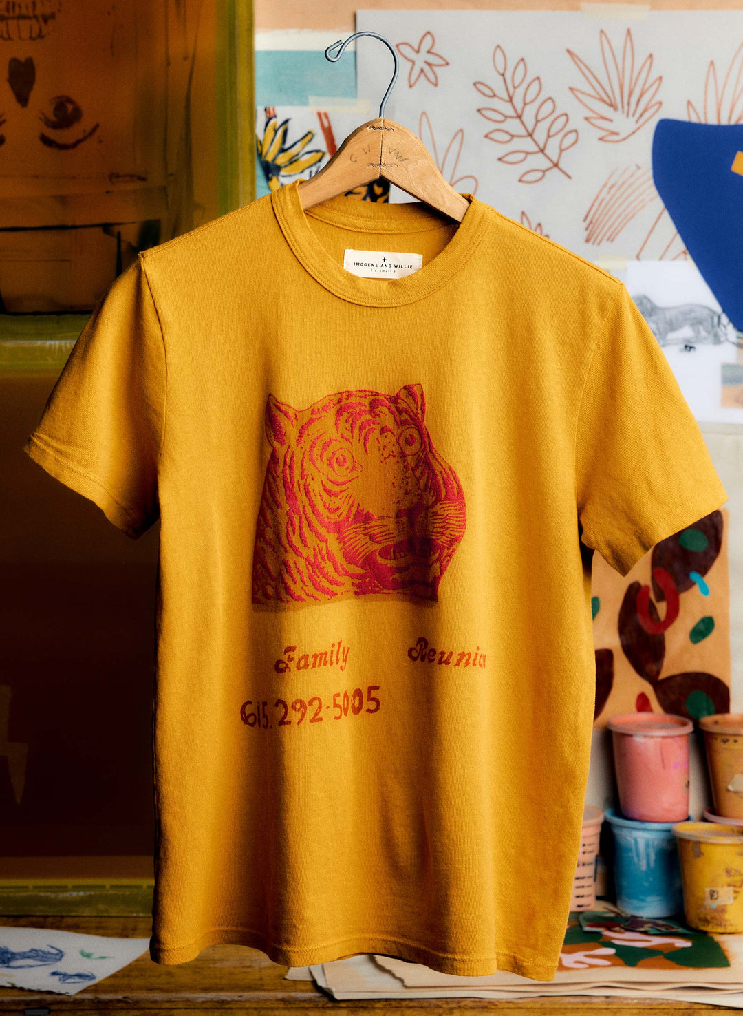 a yellow shirt with a tiger on it