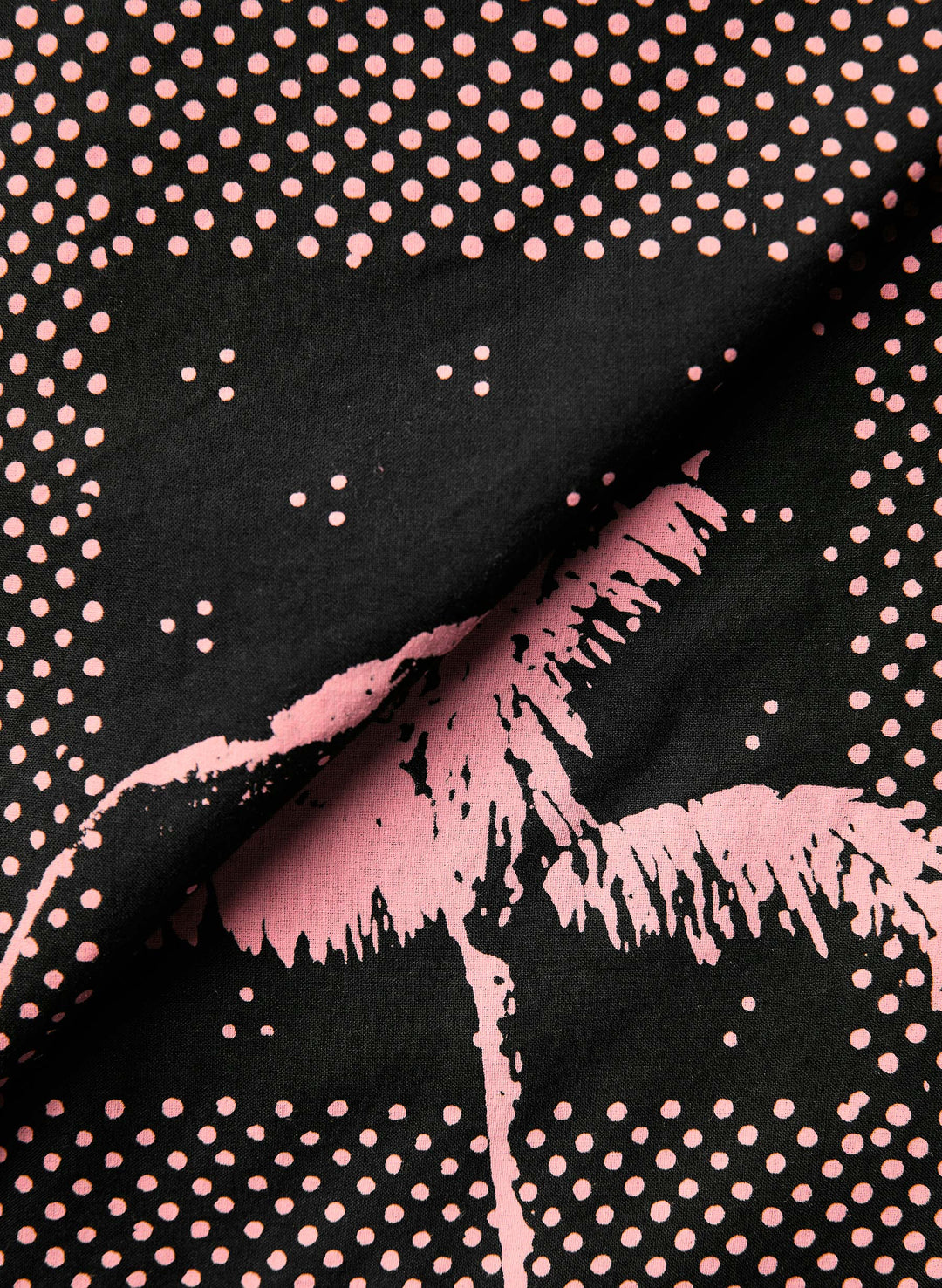 a black and pink fabric with a pink design