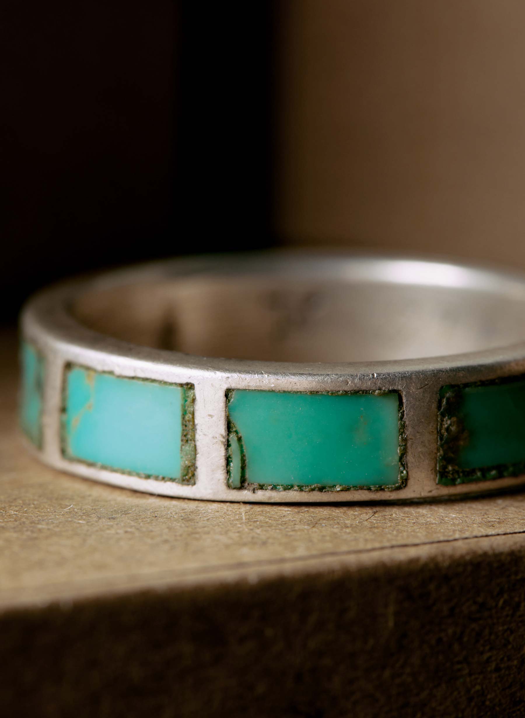Collar, Natural material, Rectangle, Tints and shades, Jewellery, Electric blue, Font, Gas, Art, Metal