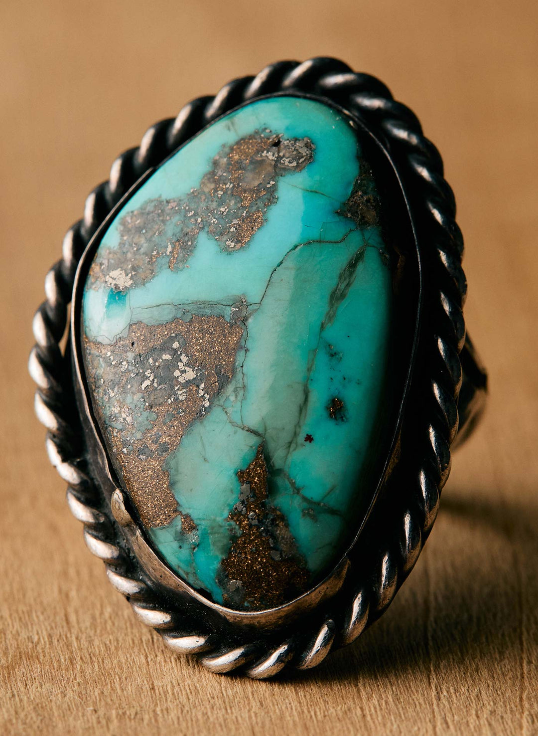 a ring with a blue stone