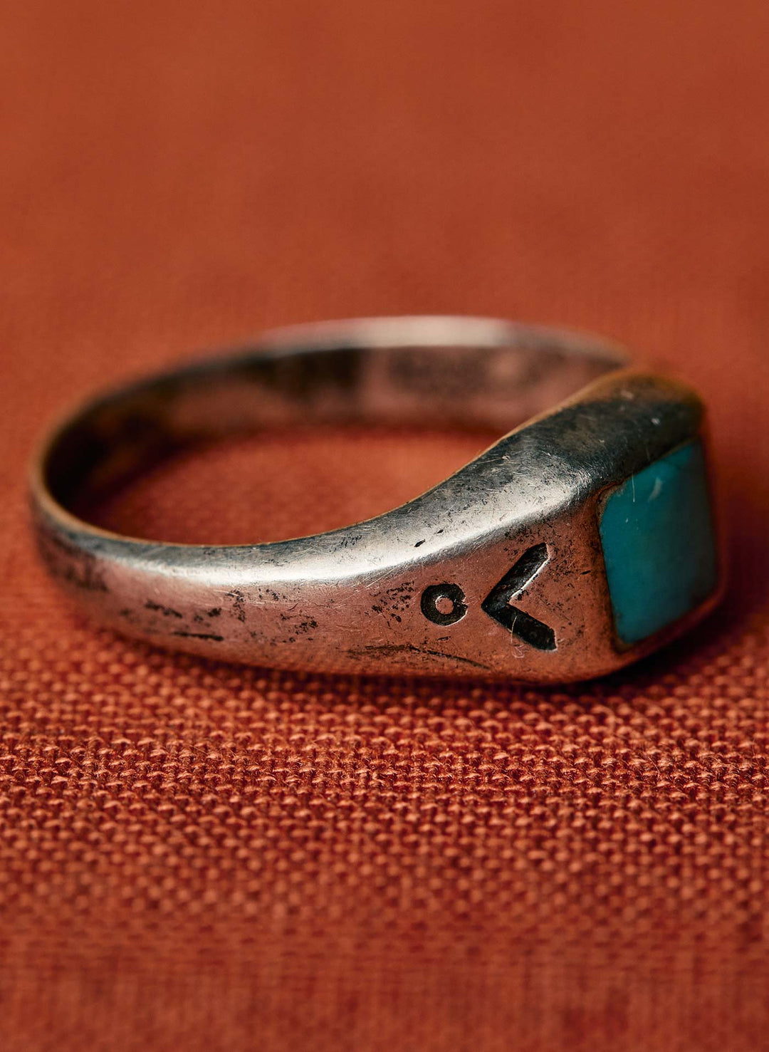 a ring with a blue stone on it