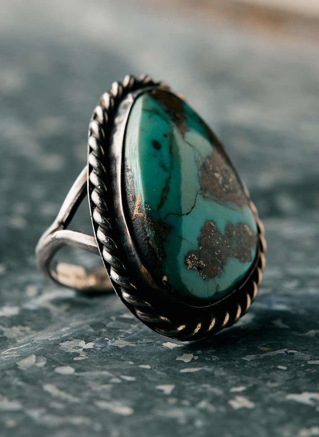 a ring with a blue stone