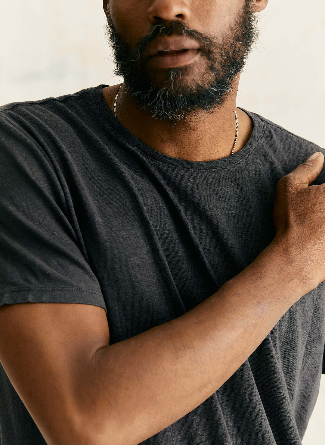 a man with beard and mustache wearing a black shirt