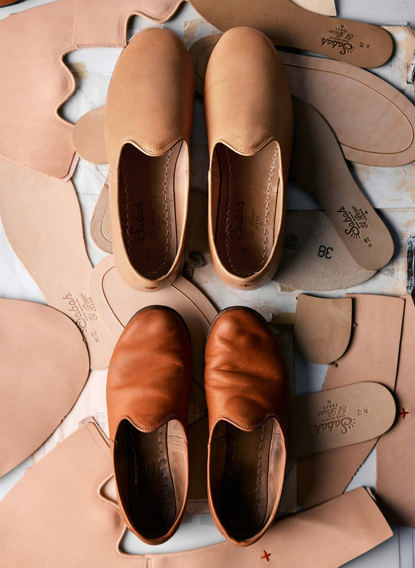 a group of shoes and leather pieces