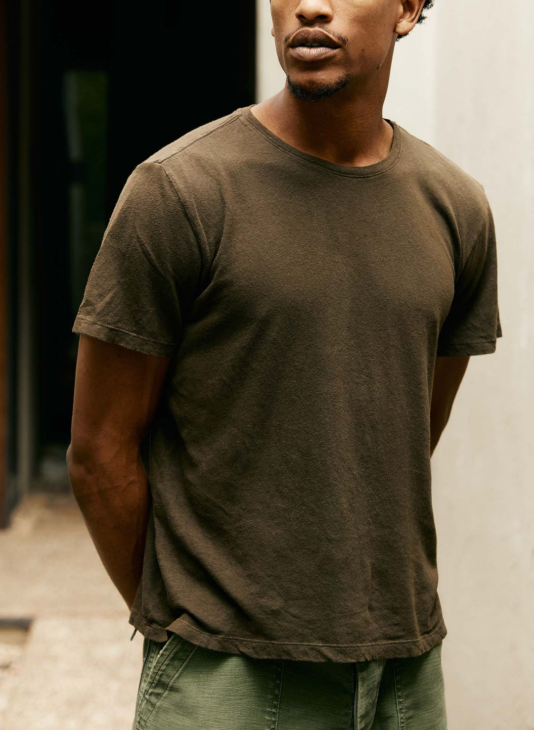 a man in a brown shirt