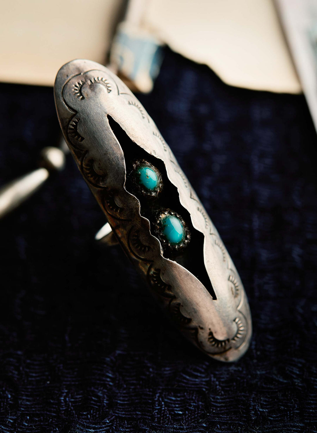 a silver ring with turquoise stones