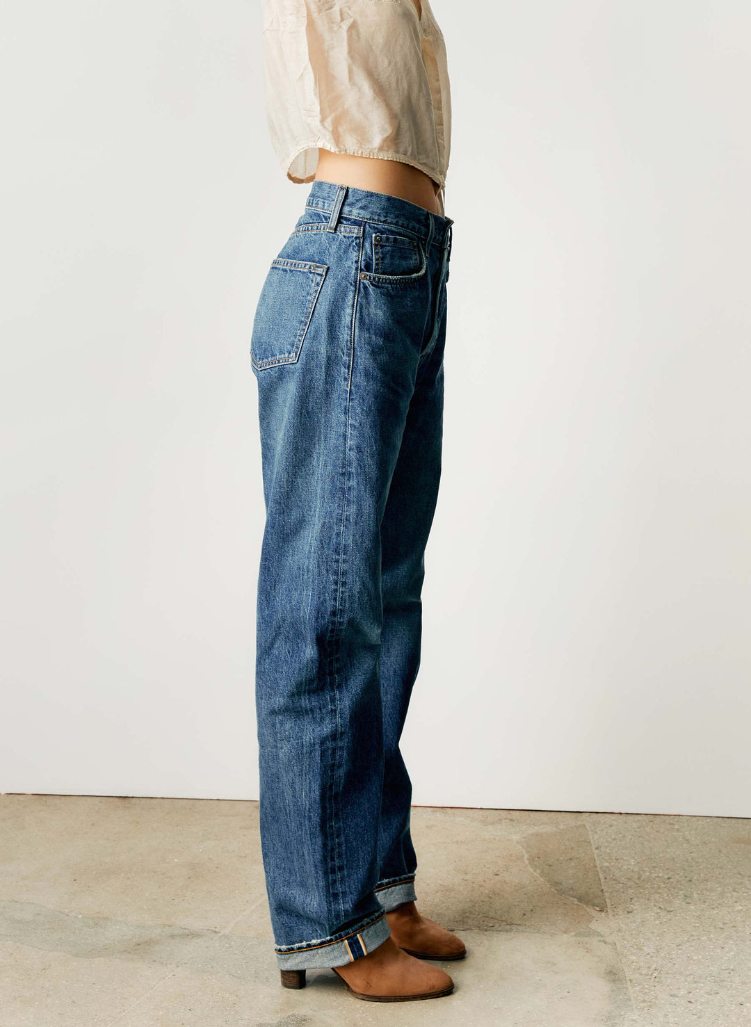 a woman wearing blue jeans