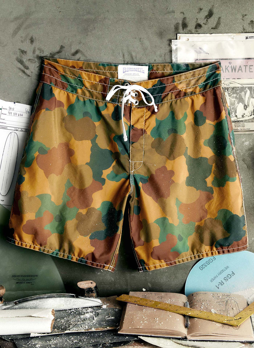 a camouflage swim shorts on a board