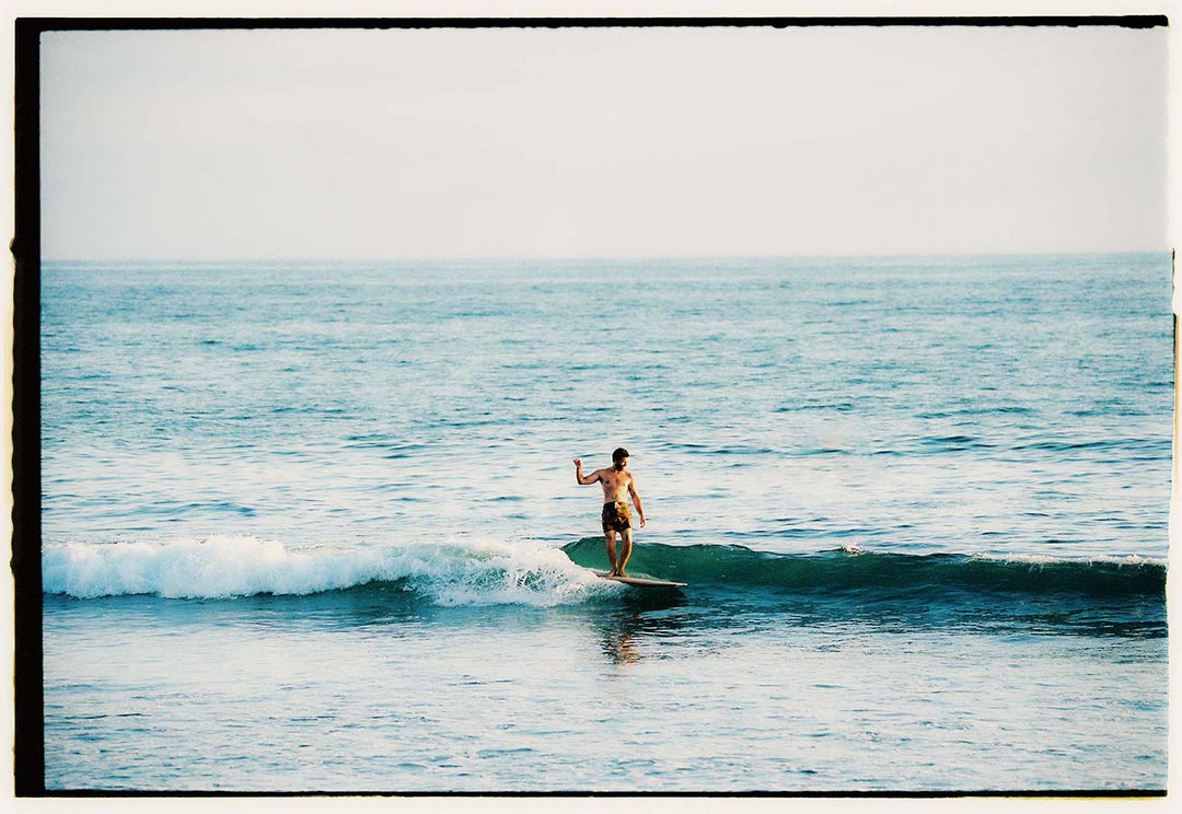 a man surfing in the ocean