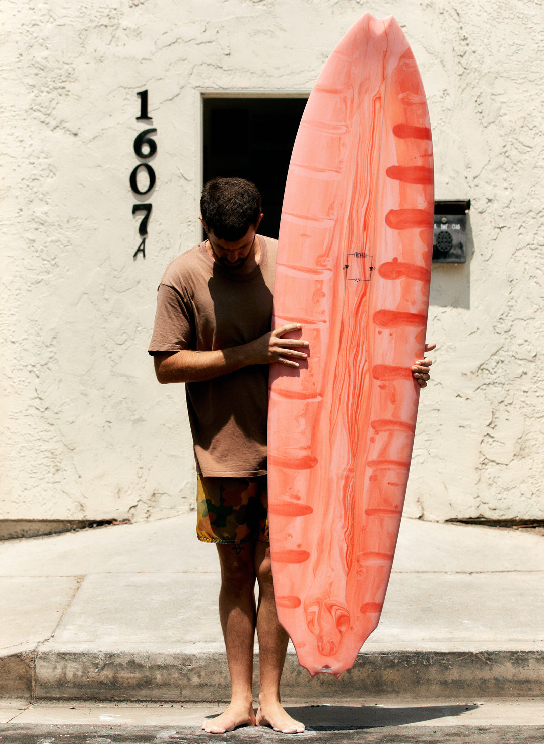 a man holding a surfboard