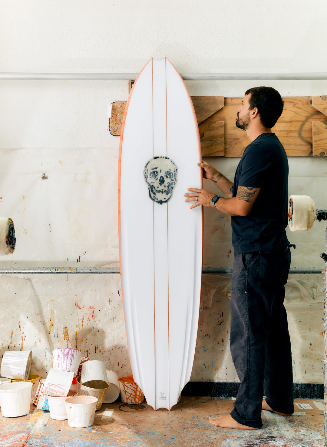 a man holding a surfboard