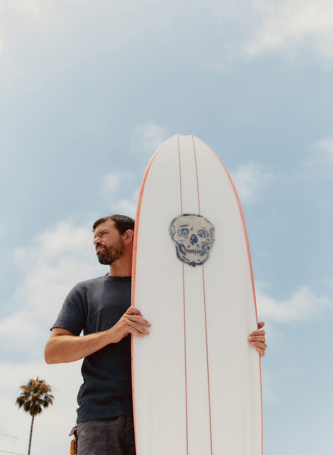 a man holding a surfboard