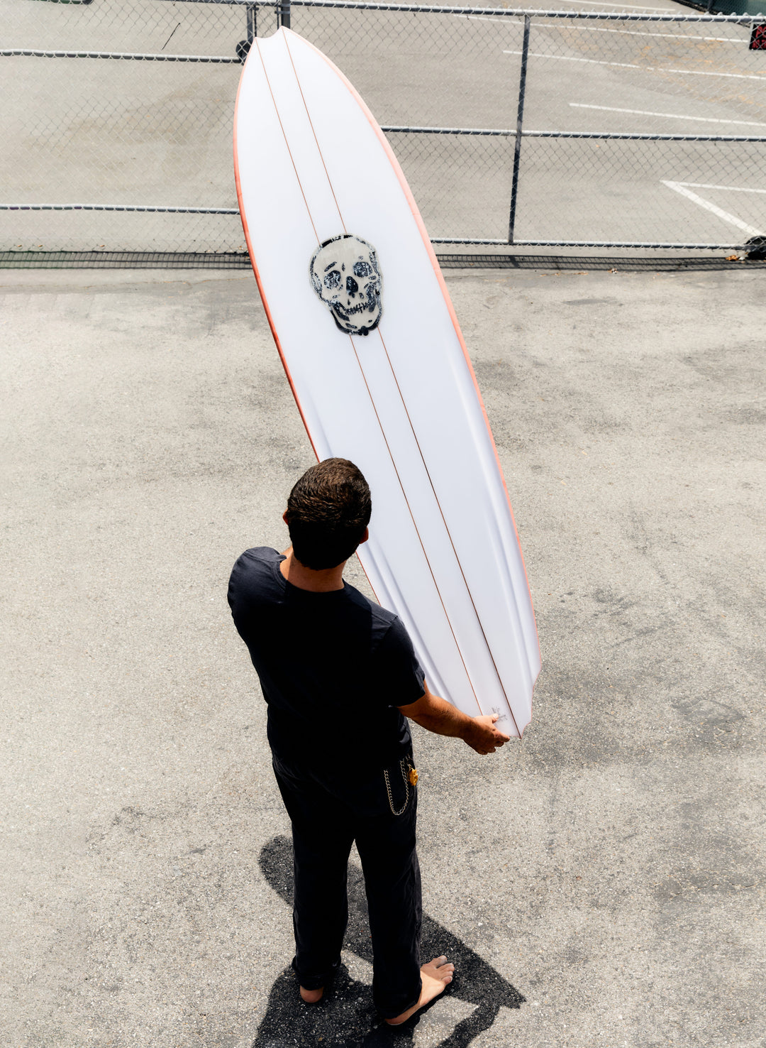 a man holding a surfboard