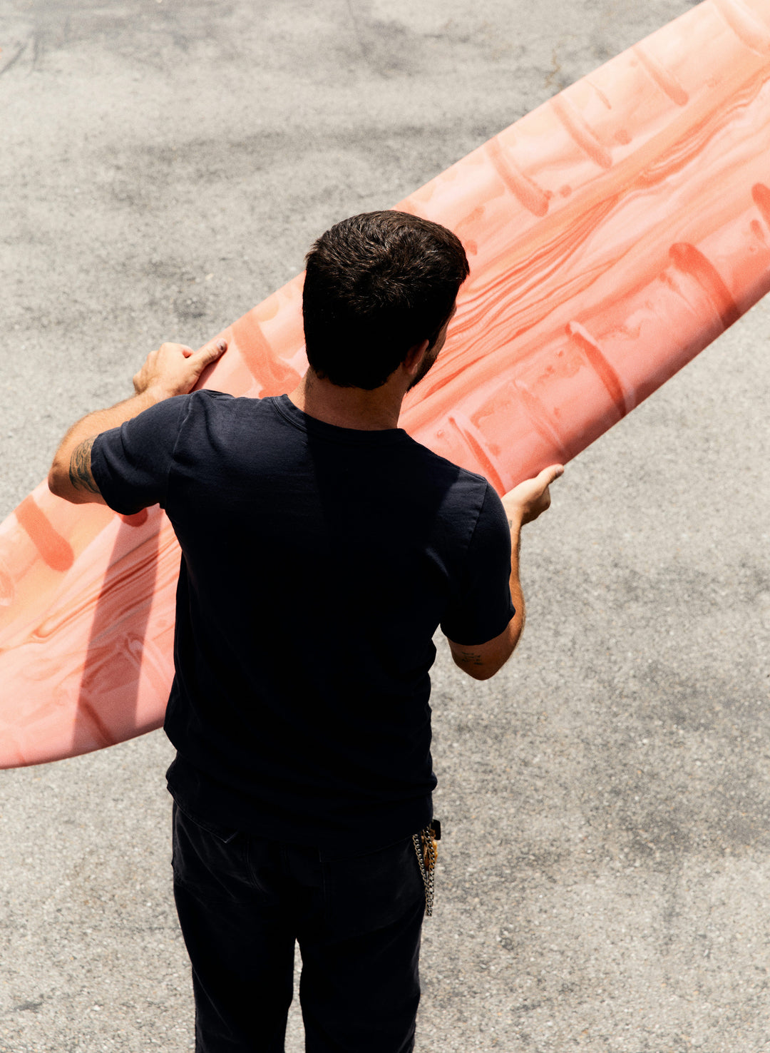 a man holding a surfboard