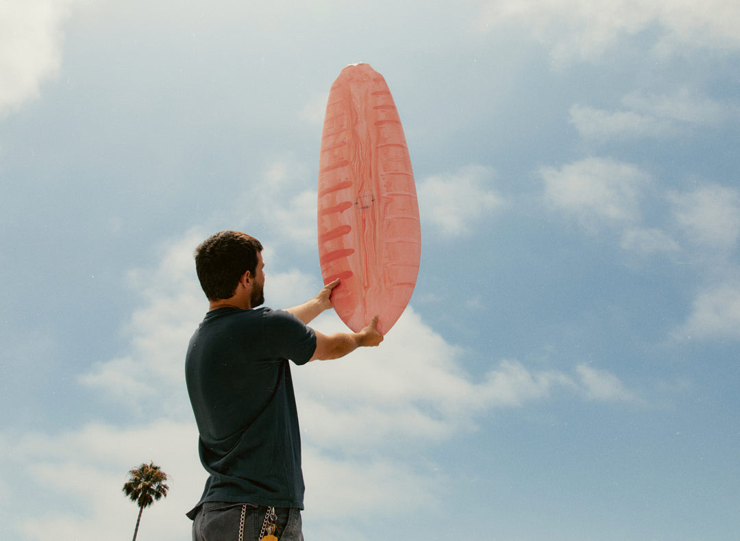 a man holding a surfboard