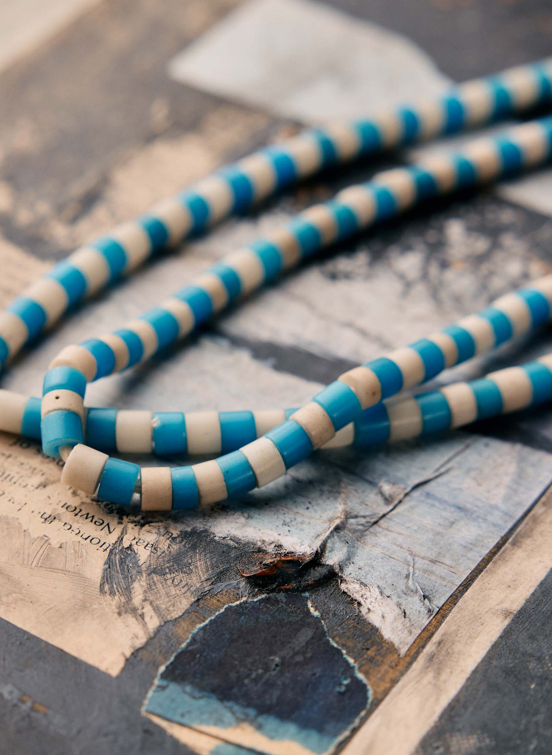 a blue and white striped necklace