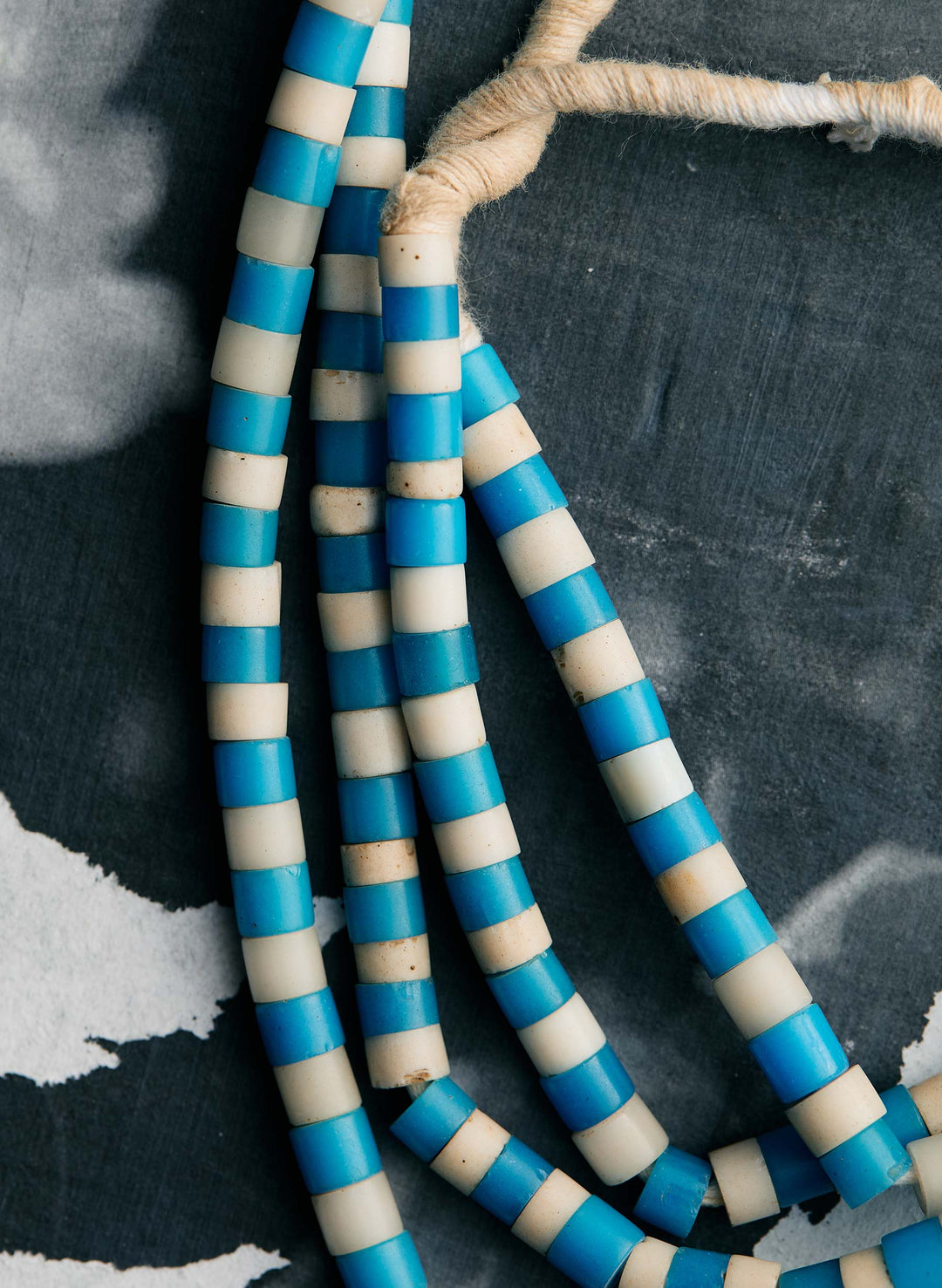 a blue and white striped beads