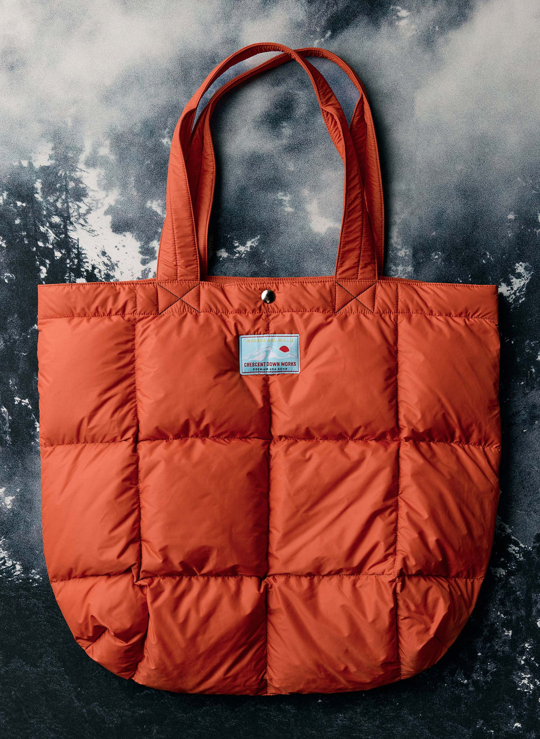 a orange bag on a black and white background