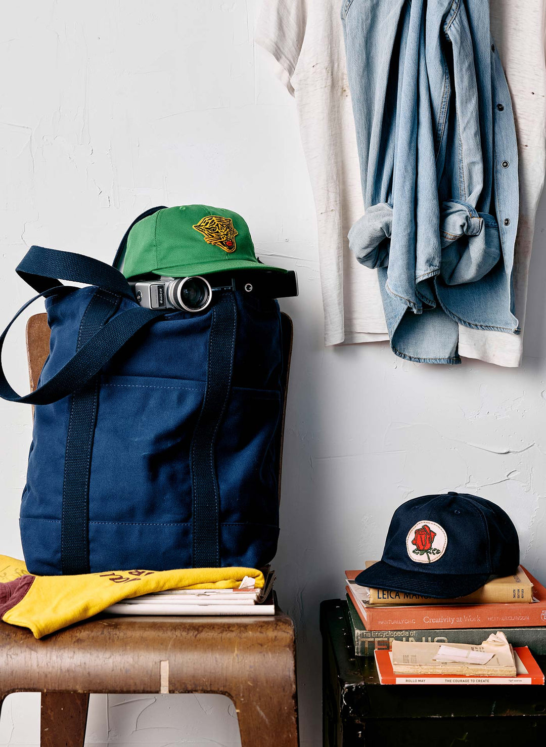 a blue bag with a green hat on top of it