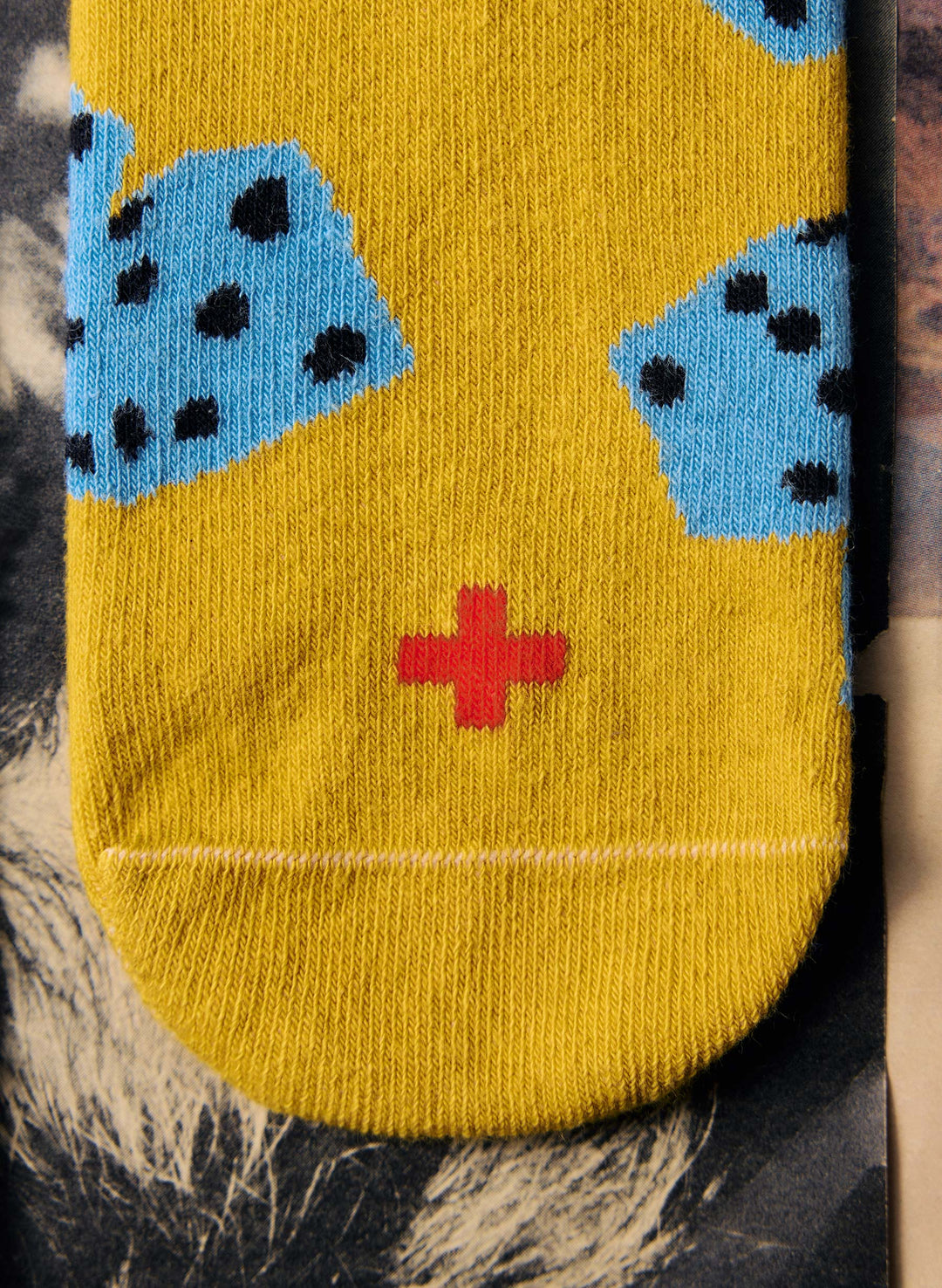 the "tumblin dice" sock in gold