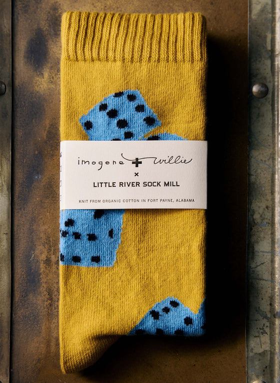 the "tumblin dice" sock in gold