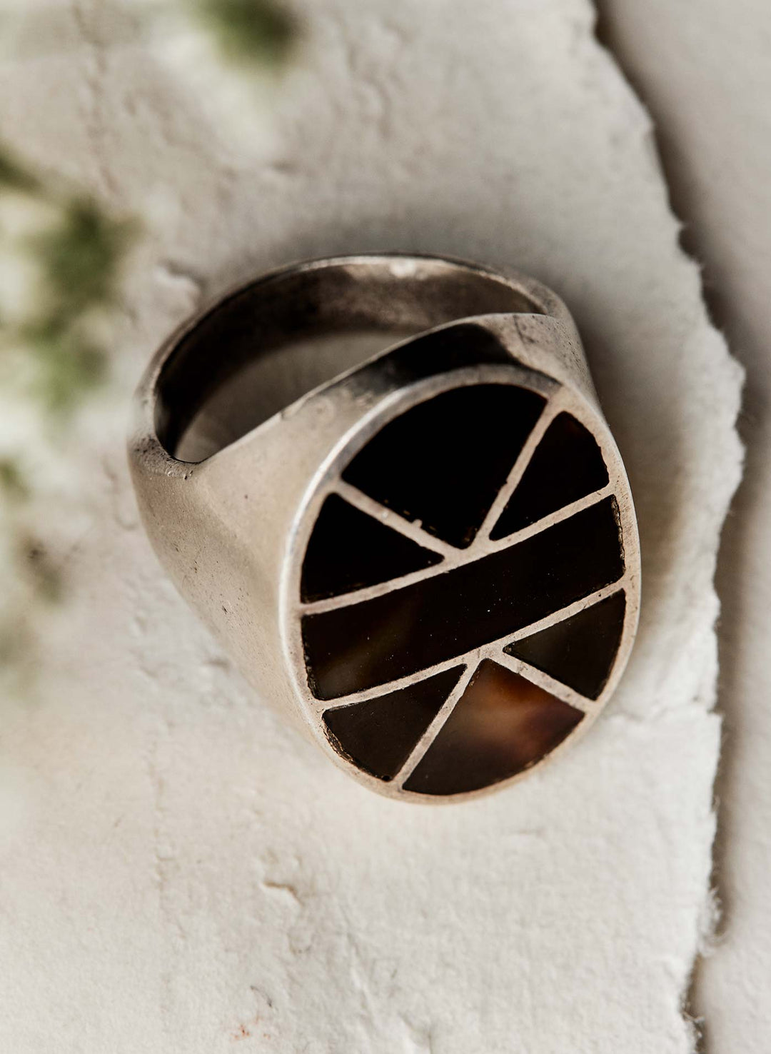 a ring with a black stone in the middle