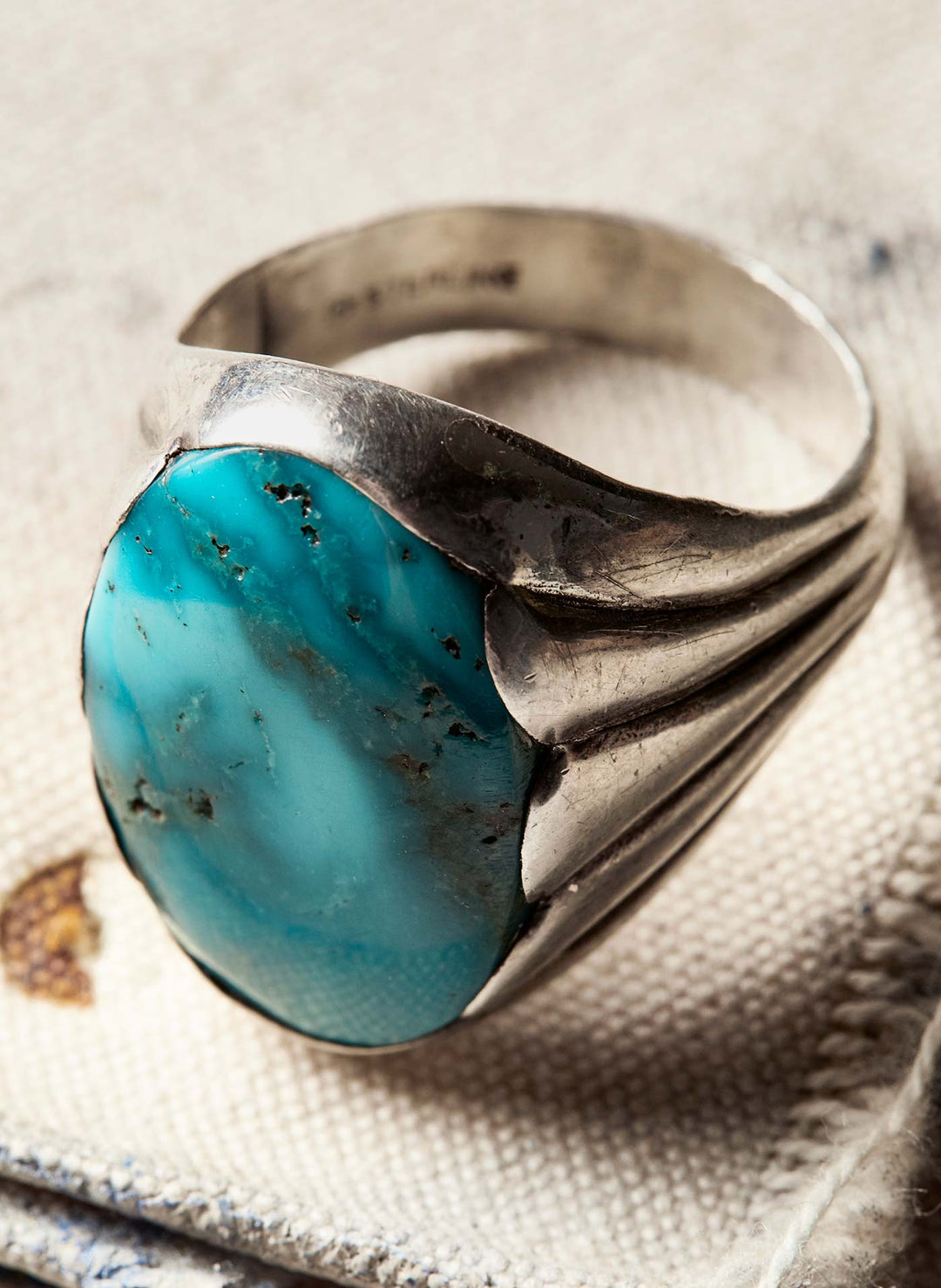 a ring with a blue stone