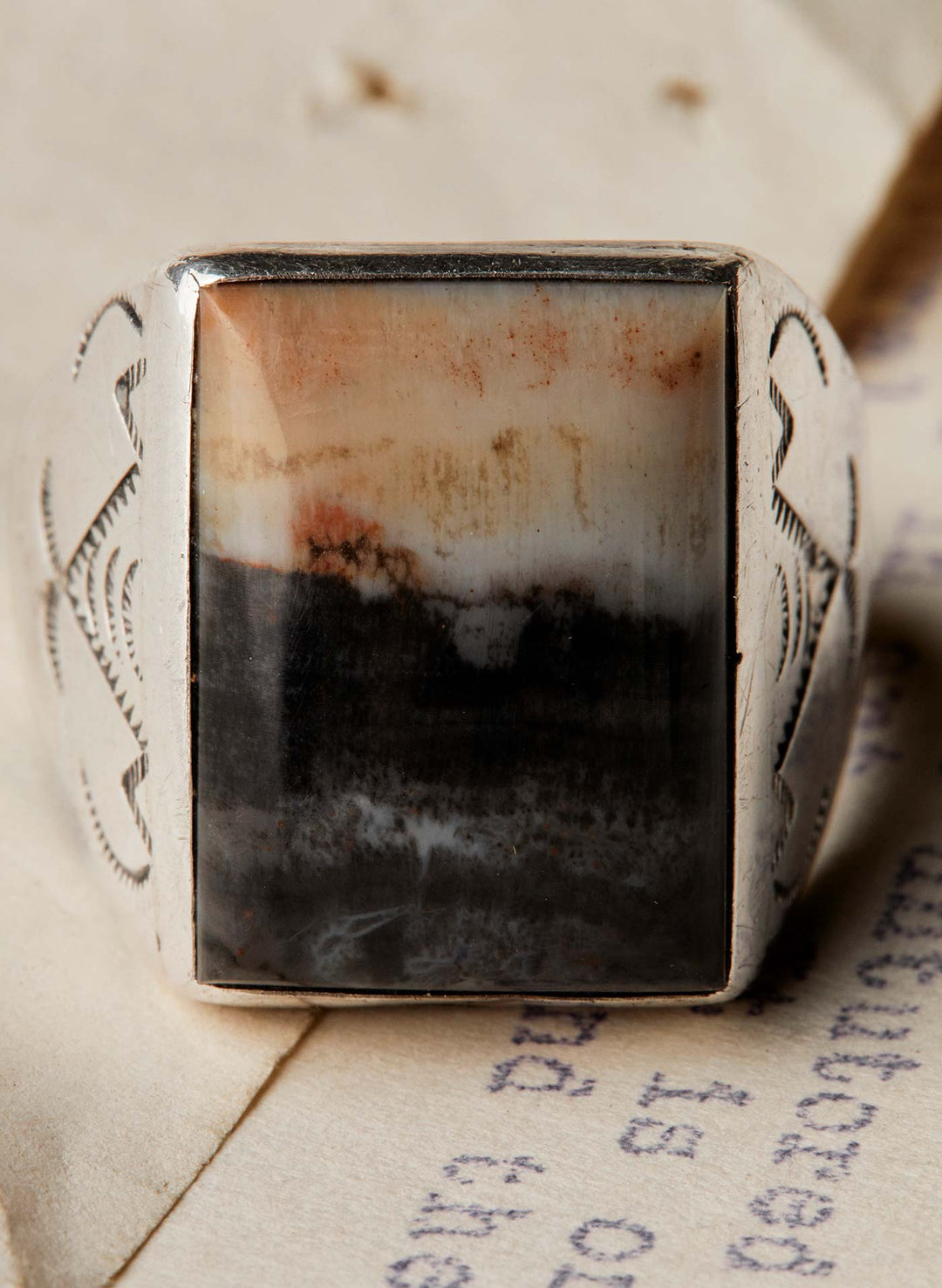 a silver ring with a stone in the middle