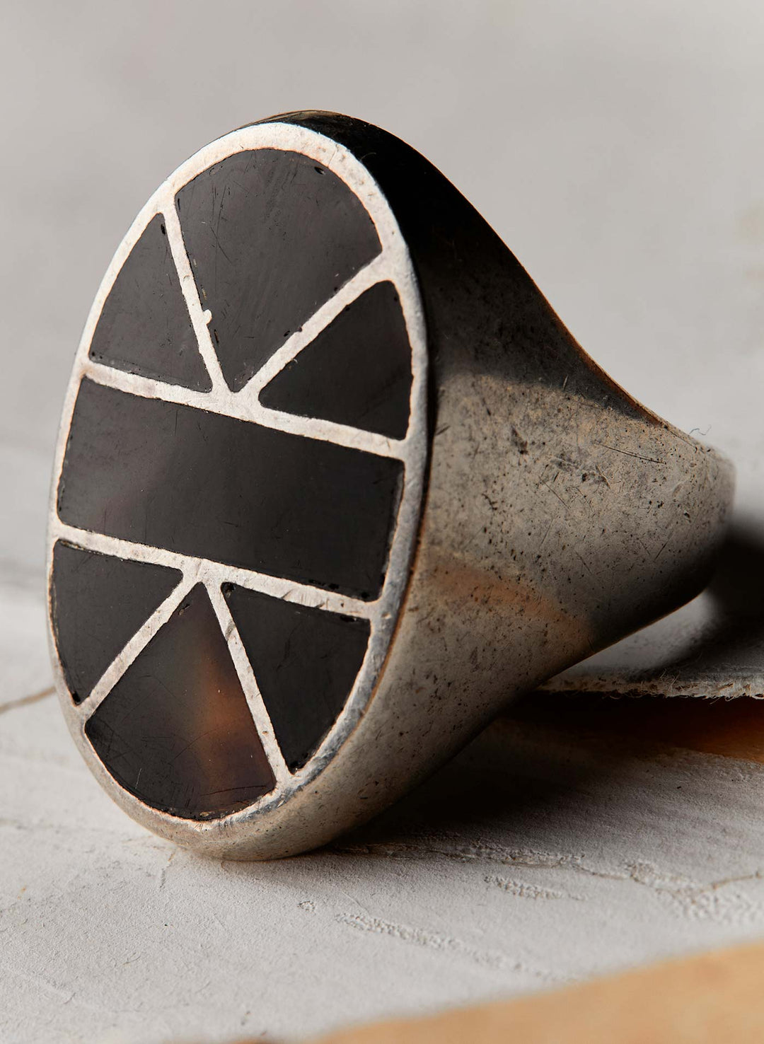 a ring with a black stone in the middle