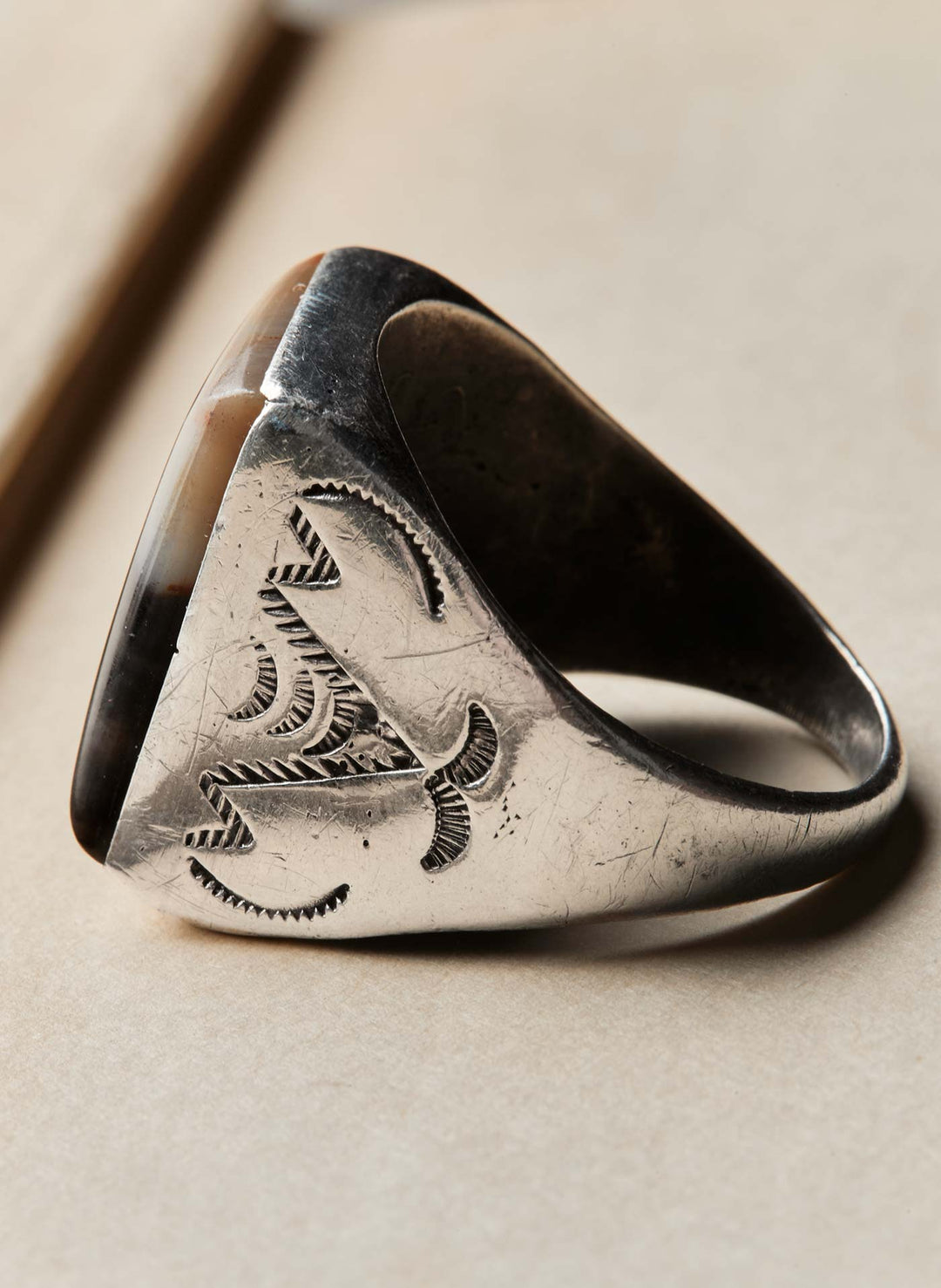 a silver ring with a stone on it