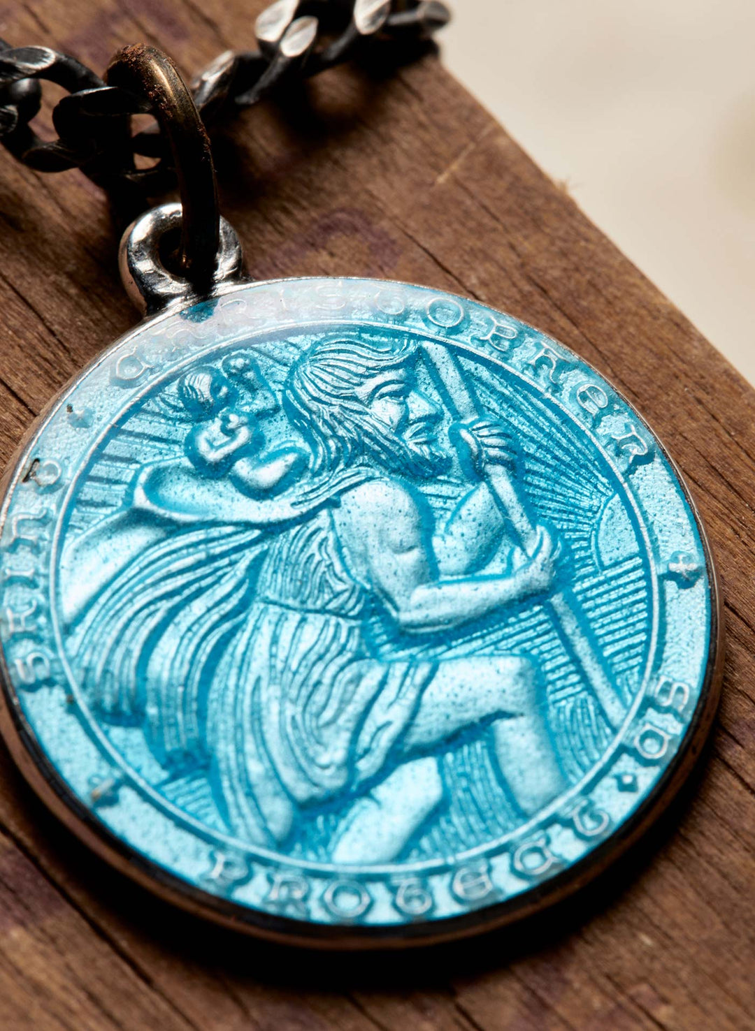 a blue medallion with a picture on it