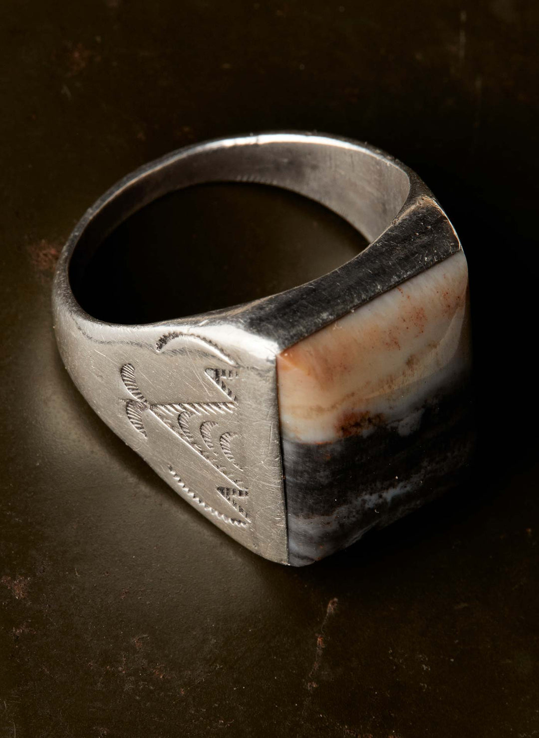 a silver ring with a stone in the middle