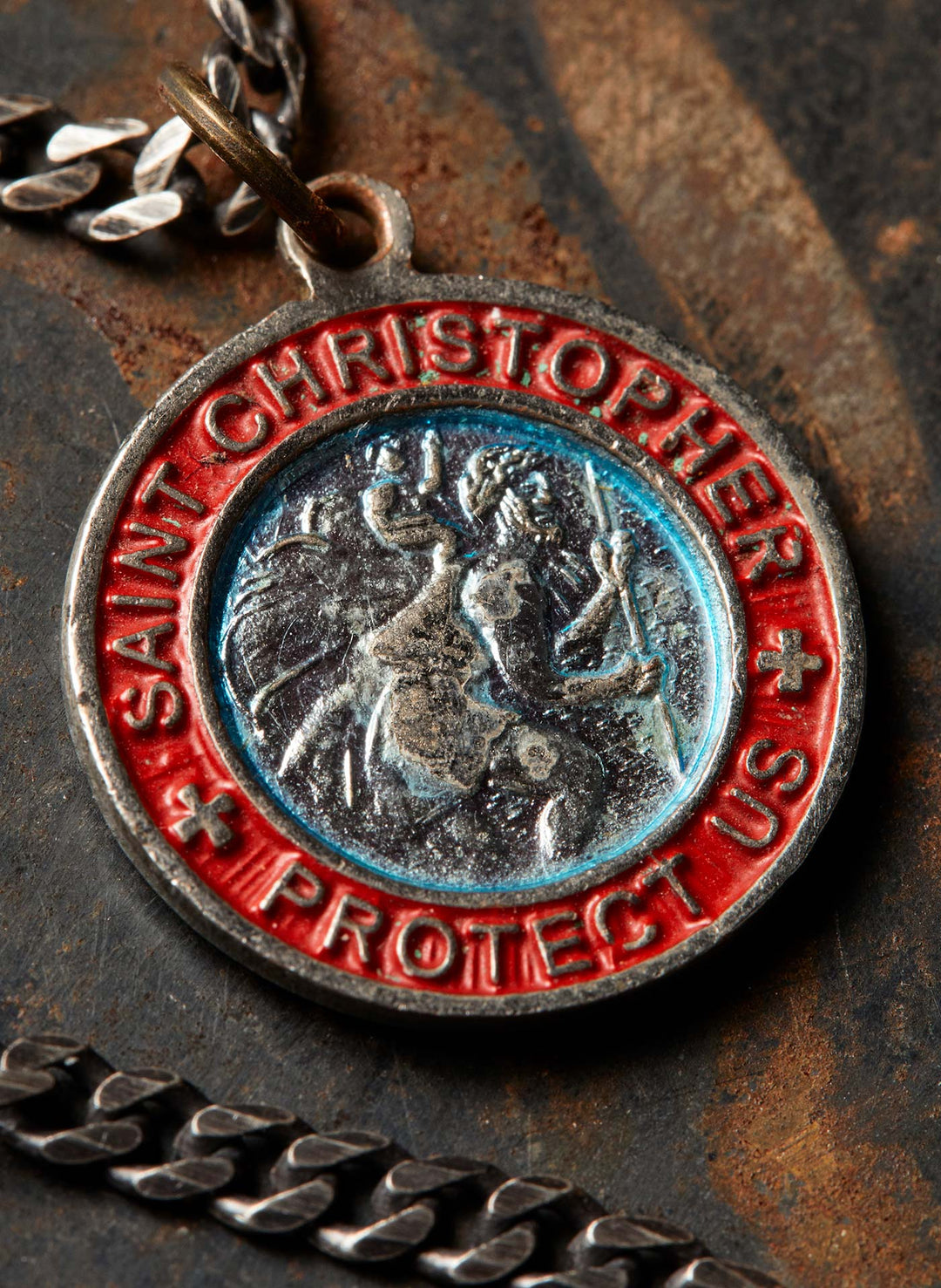 a medallion with a red and blue design