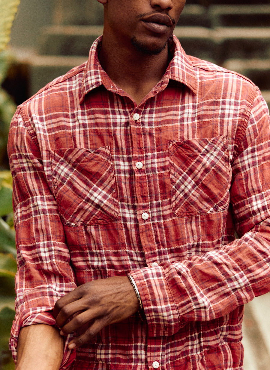 a man wearing a red plaid shirt