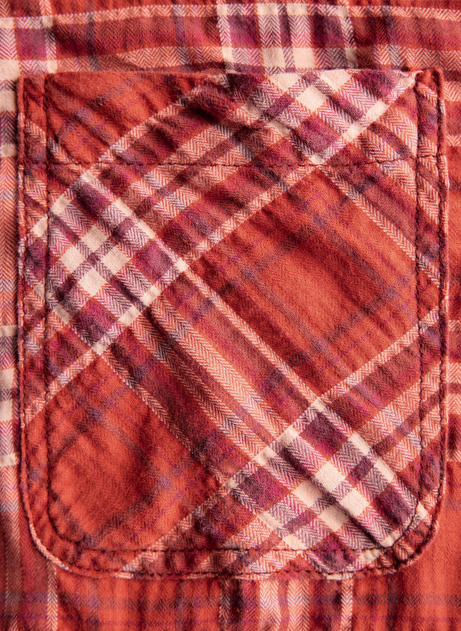 a pocket on a red and white plaid shirt