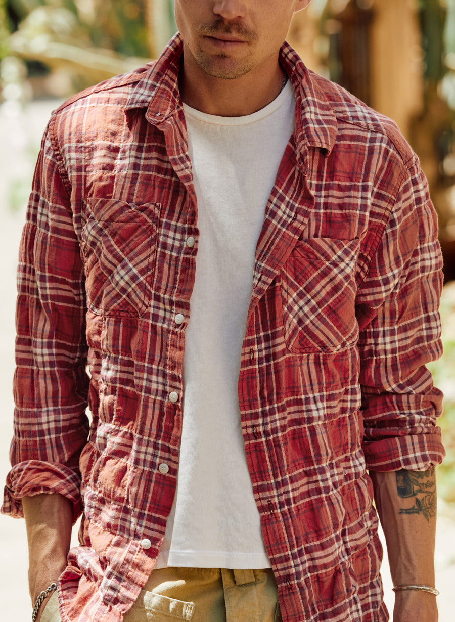 a man wearing a red flannel shirt